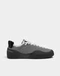 Village PM 1PM Leather Suede Shoes in Grey/Natural Black: a single shoe seen side on from the outer side, toe to the right. A grey leather and suede low-top skate shoe on a natural black gum outsole.