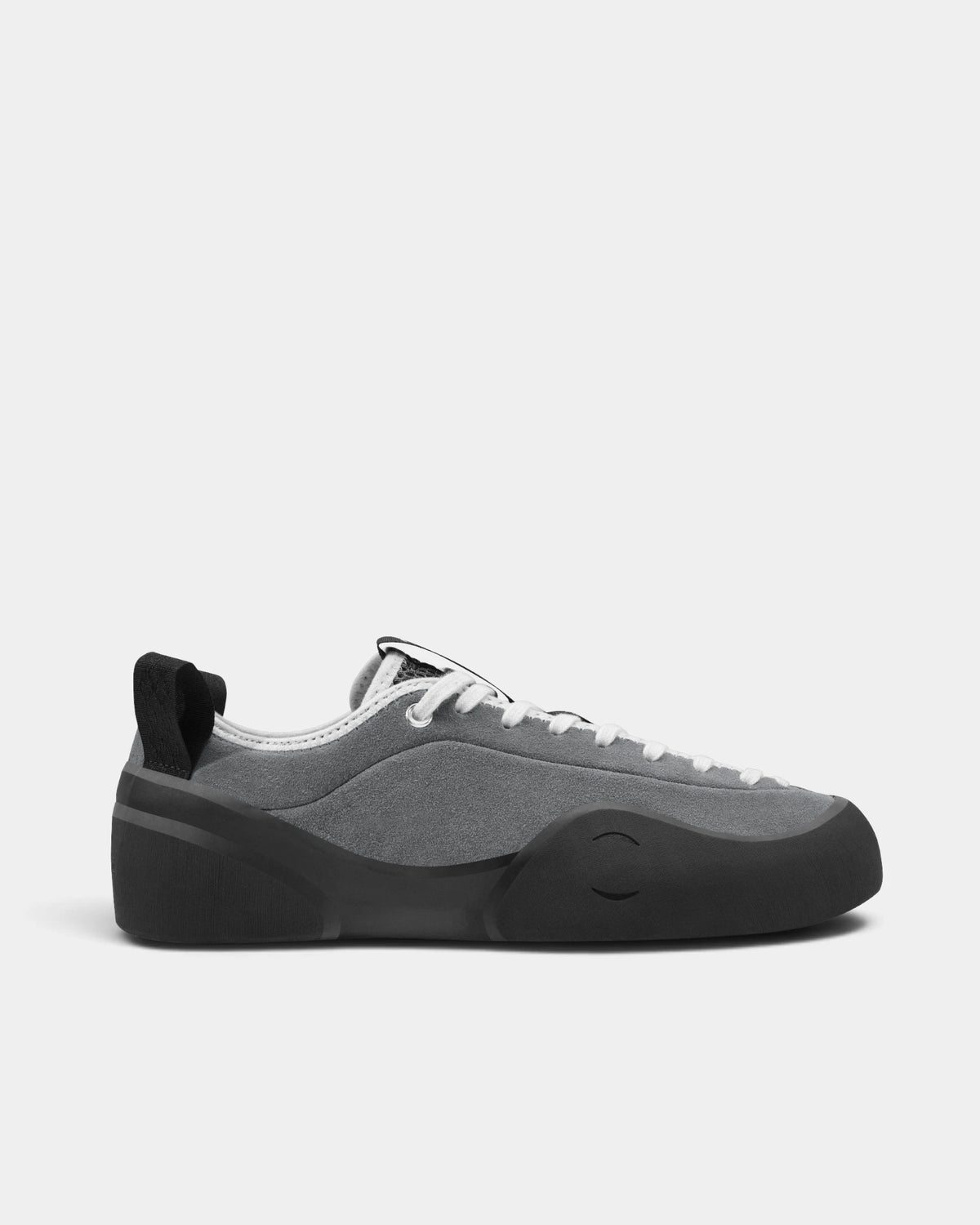 Village PM 1PM Leather Suede Shoes in Grey/Natural Black: a single shoe seen side on from the outer side, toe to the right. A grey leather and suede low-top skate shoe on a natural black gum outsole.
