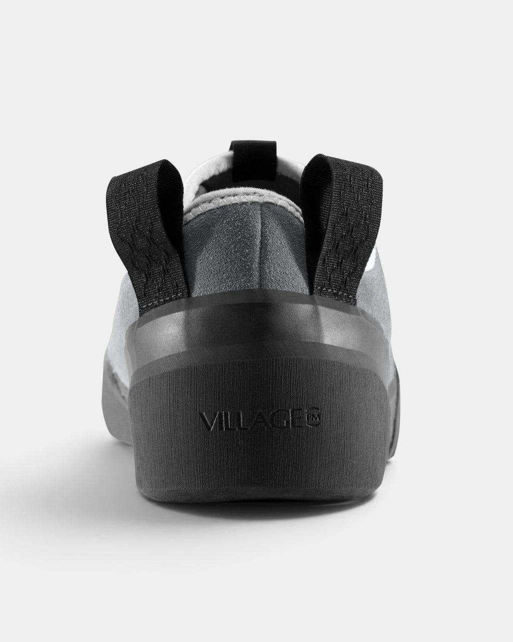 Village PM 1PM Leather Suede Shoes in Grey/Natural Black: a single shoe seen straight on from behind, showing the heel counter and collar. A grey leather and suede low-top skate shoe on a natural black gum outsole.