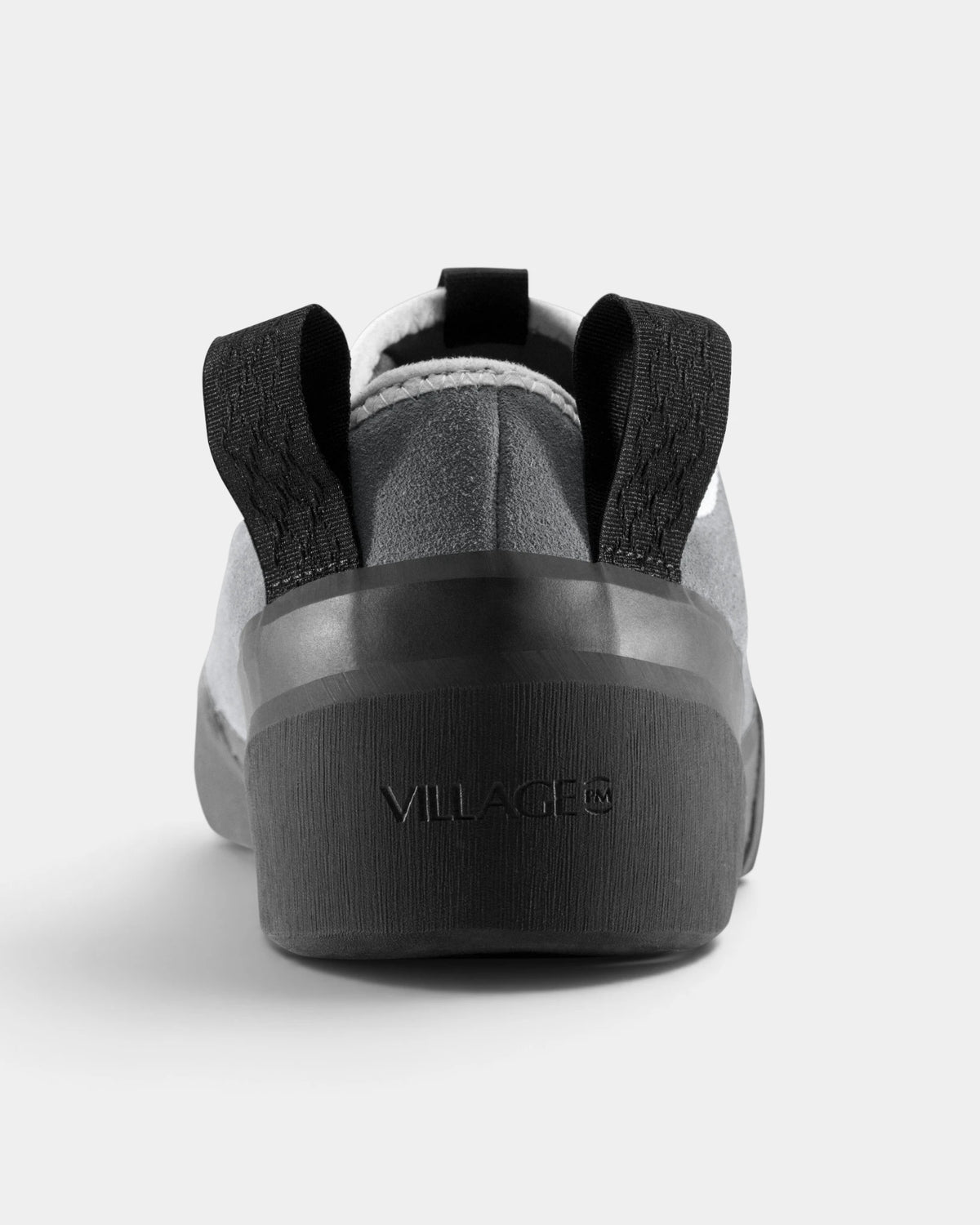 Village PM 1PM Leather Suede Shoes in Grey/Natural Black: a single shoe seen straight on from behind, showing the heel counter and collar. A grey leather and suede low-top skate shoe on a natural black gum outsole.