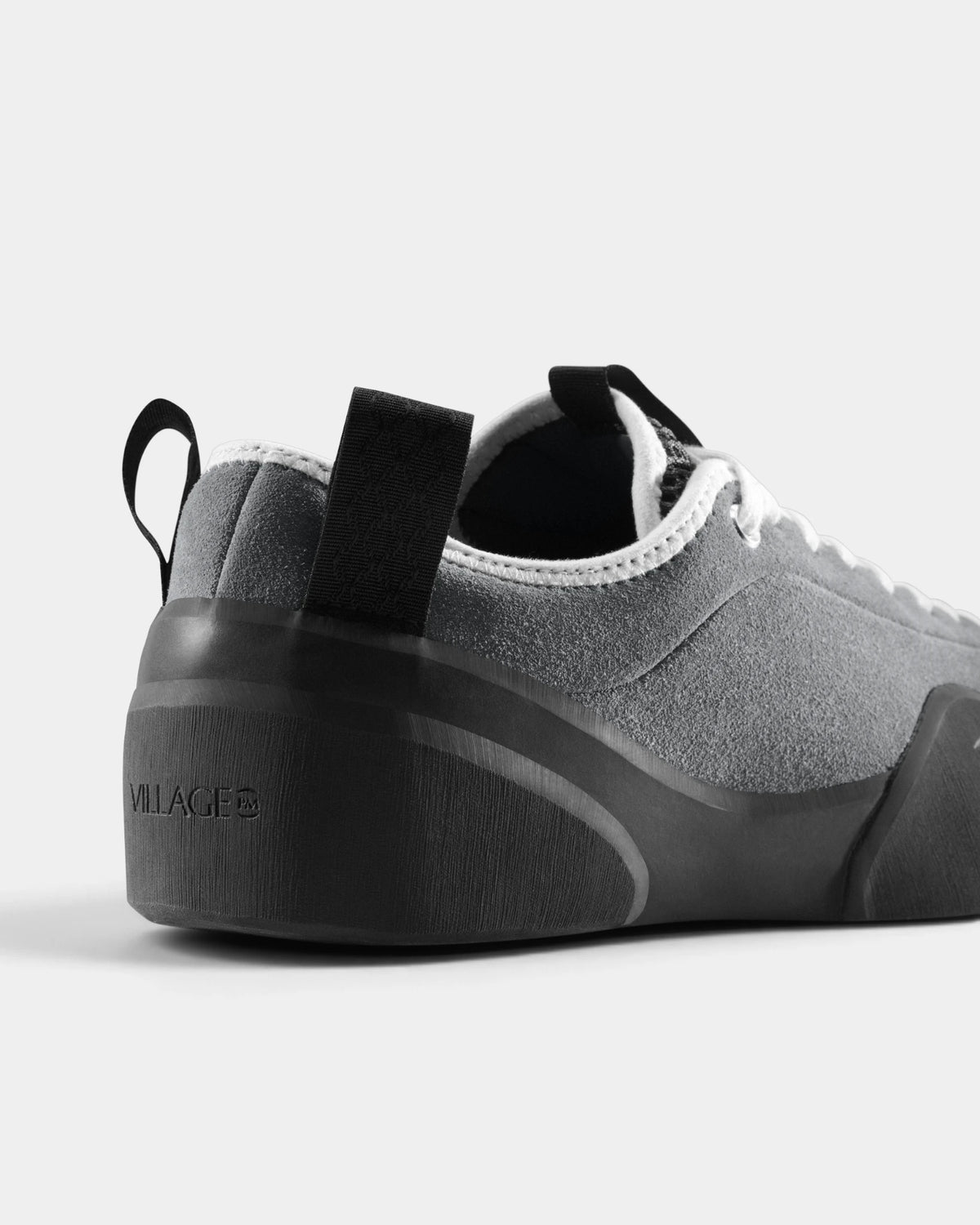 Village PM 1PM Leather Suede Shoes in Grey/Natural Black: a close three-quarter view of the heel and the outer side. A grey leather and suede low-top skate shoe on a natural black gum outsole.