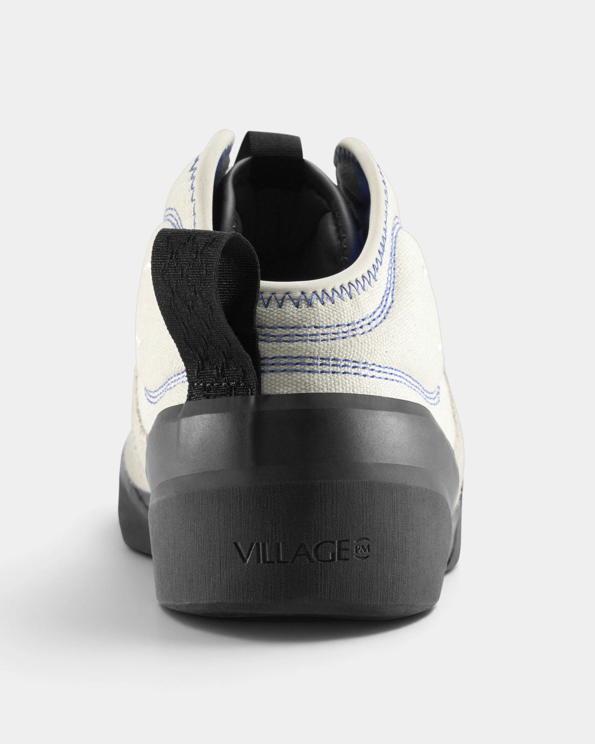 Village PM 1PM MID Leather Suede Shoes in Cream-Blue/Natural Black: a single shoe seen straight on from behind, showing the heel counter and collar. A cream and blue leather and suede mid-top skate shoe on a natural black gum outsole.
