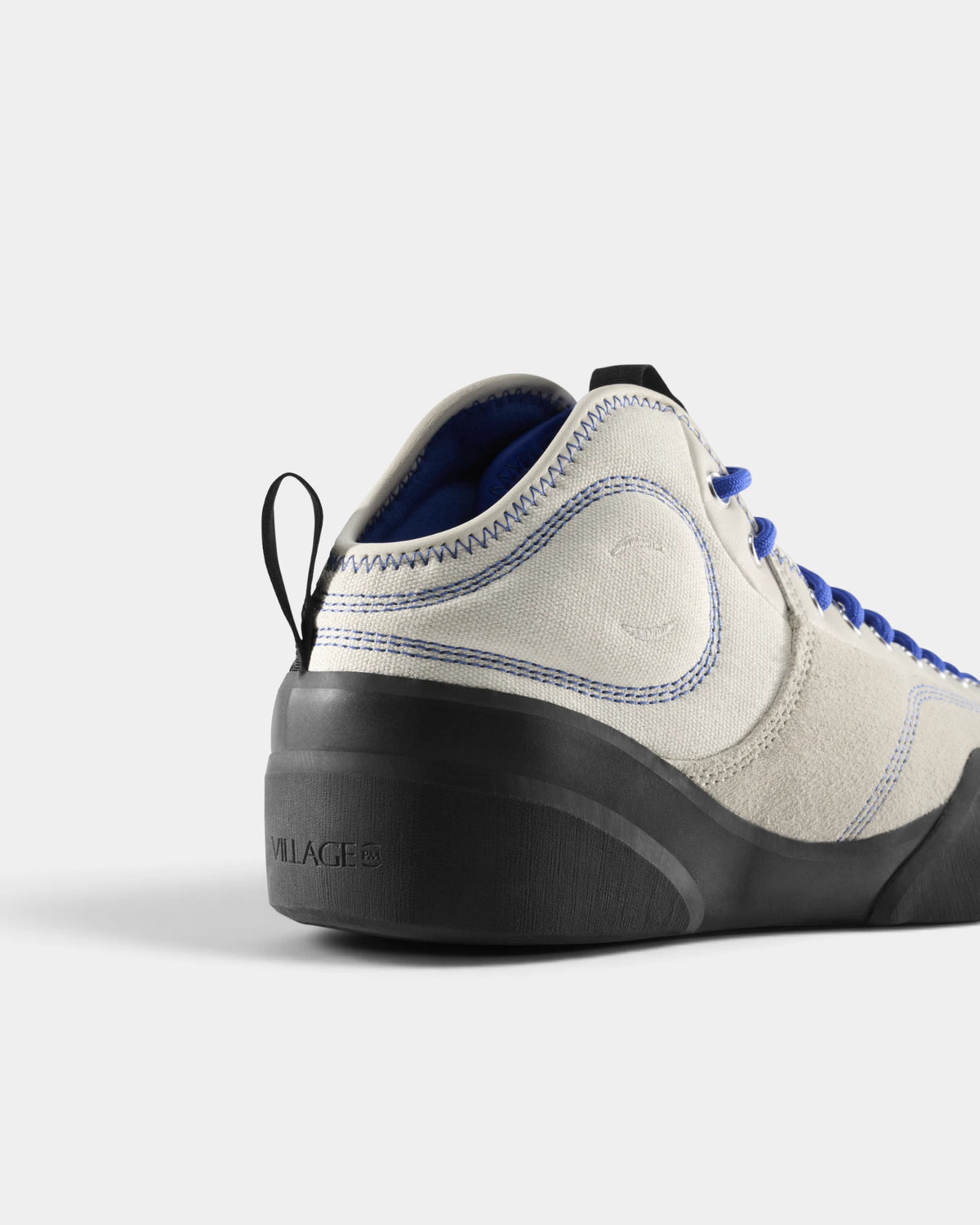 Village PM 1PM MID Leather Suede Shoes in Cream-Blue/Natural Black: a close three-quarter view of the heel and the outer side. A cream and blue leather and suede mid-top skate shoe on a natural black gum outsole.