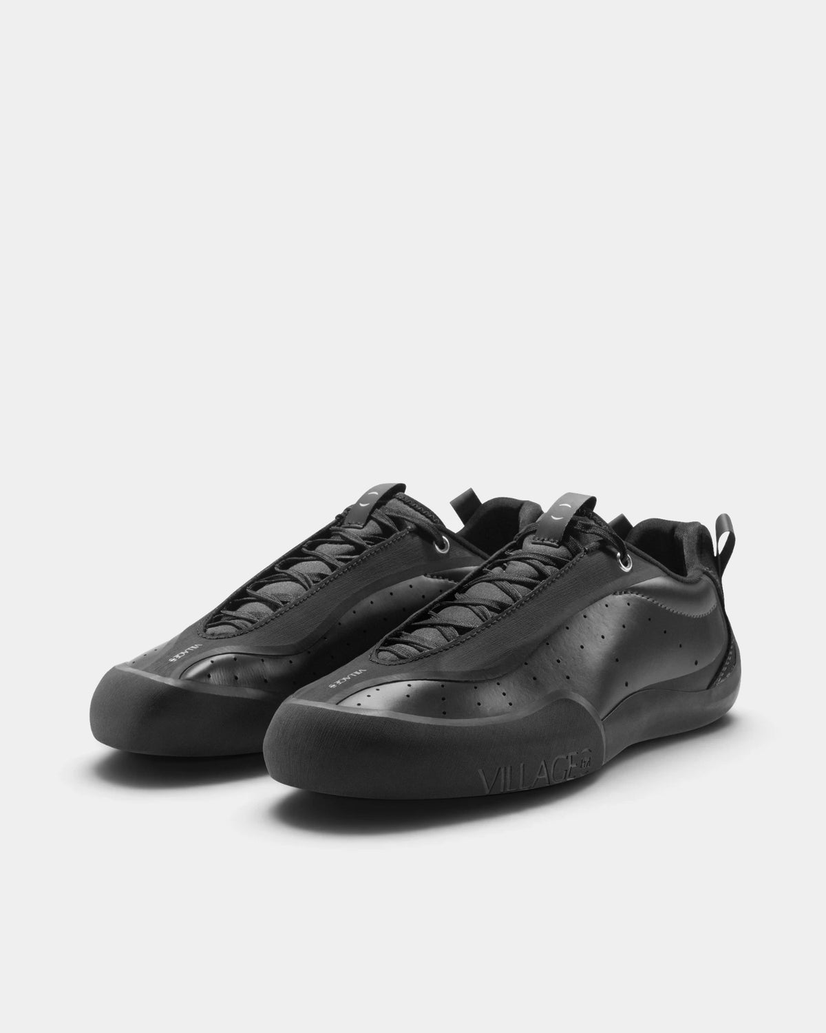 Village PM 2PM Synth Leather Shoes in Anthracite/Natural Black: the pair seen from the front three-quarter angle, toes to the right. A anthracite synthetic leather low-top skate shoe on a natural black gum outsole.