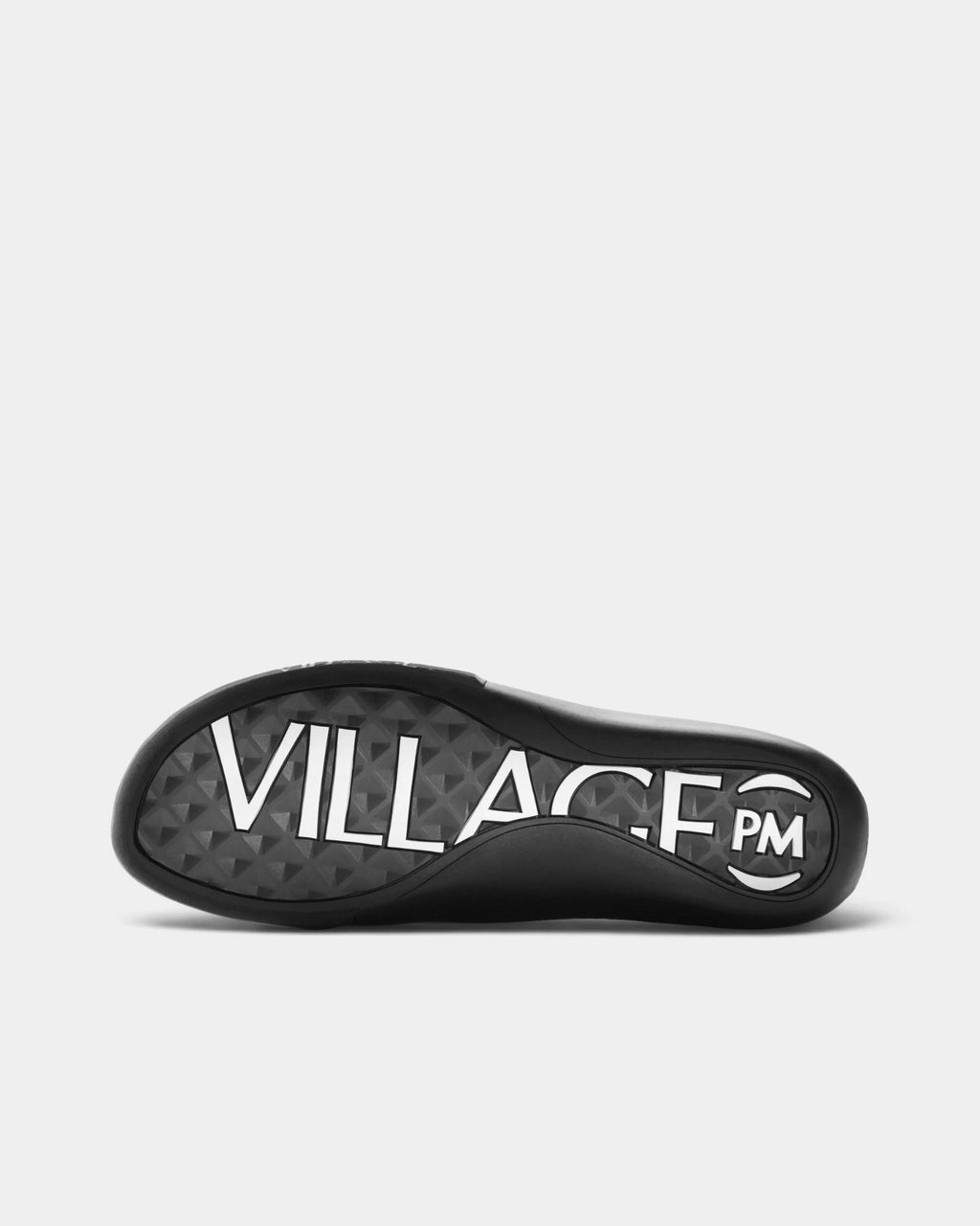 Village PM 2PM Synth Leather Shoes in Anthracite/Natural Black: the outsole seen from below, showing the tread pattern. A anthracite synthetic leather low-top skate shoe on a natural black gum outsole.