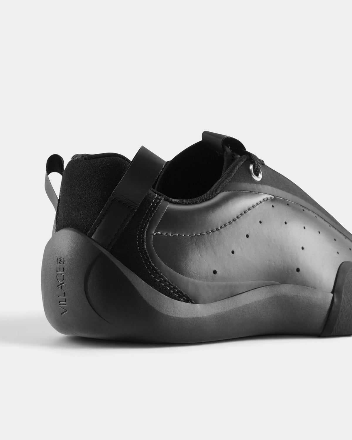 Village PM 2PM Synth Leather Shoes in Anthracite/Natural Black: a close three-quarter view of the heel and the outer side. A anthracite synthetic leather low-top skate shoe on a natural black gum outsole.