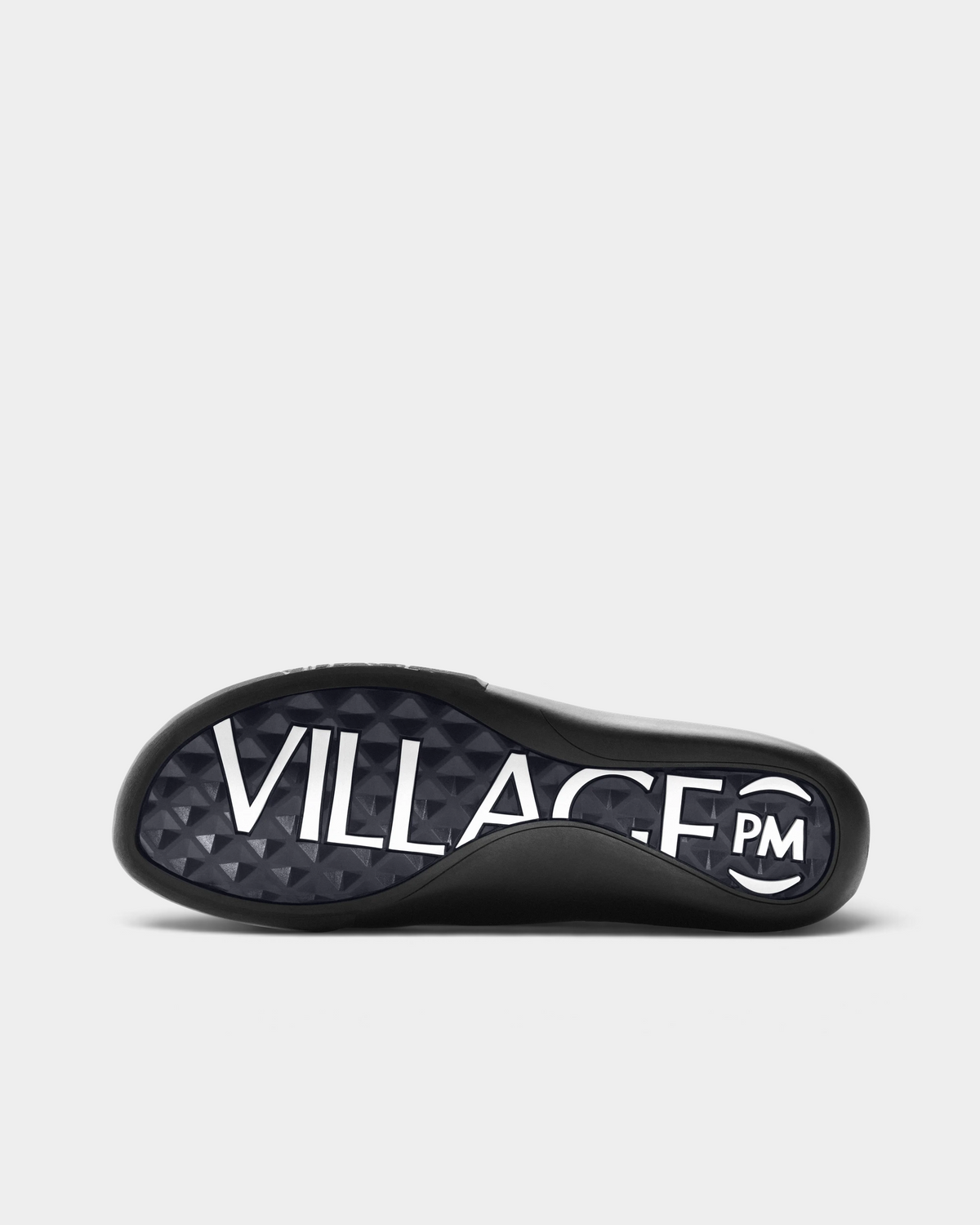 Village PM 2PM Synth Leather Shoes in Red/Natural Black: a red perforated leather low-top skate shoe with black overlays and a black sole, turned over to show the outsole and its tread pattern